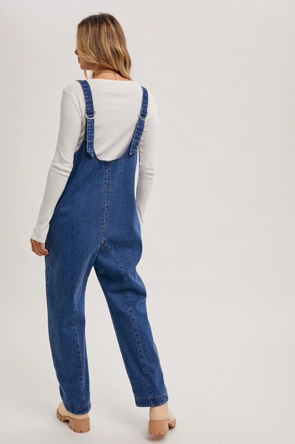 Relaxed denim harem jumpsuit styled with sandals for a laid-back look