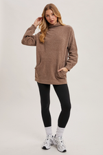 Cozy ribbed knit tunic sweater with high neckline and slim fit sleeves