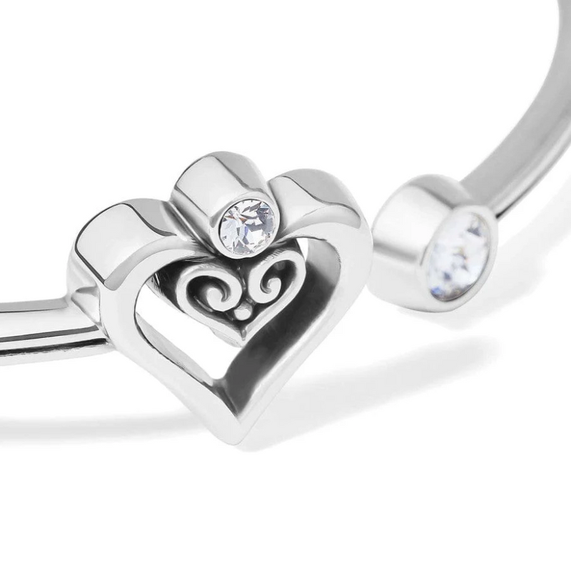 Close-up of double heart design with crystal on open bangle