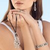Model wearing Brighton Interlok Braid Leather Necklace, capturing Ogunquit's coastal elegance