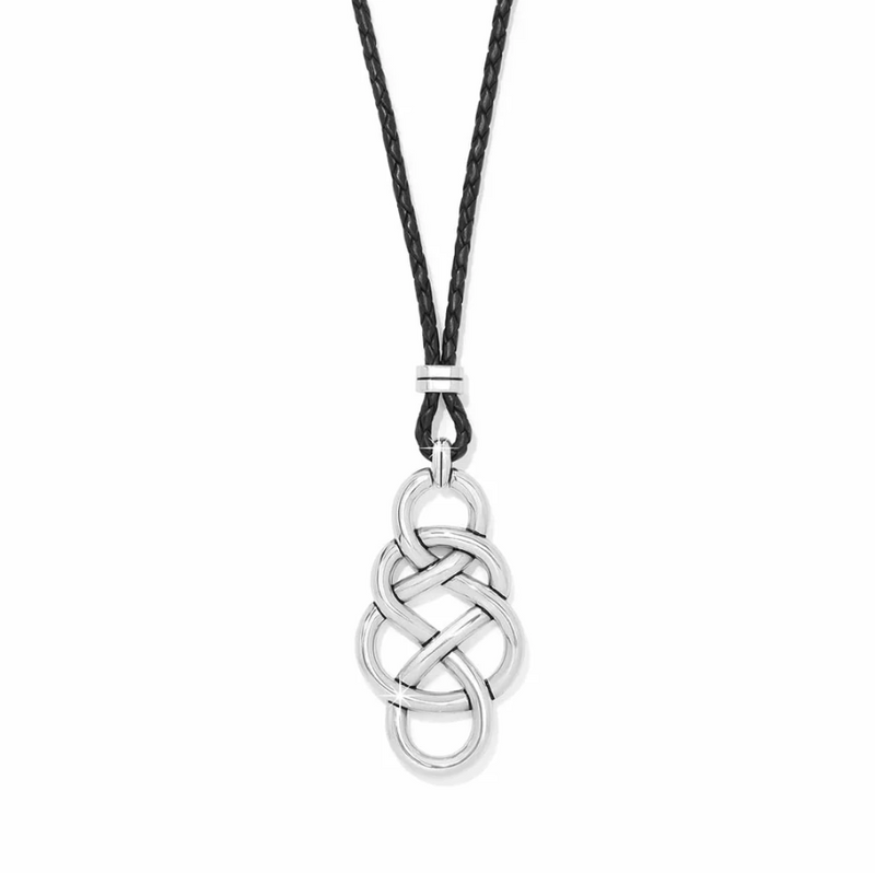Close-up of silver-plated Celtic knot pendant on braided leather cord