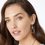 Silver-plated hoop drop earrings featuring interlocking knots