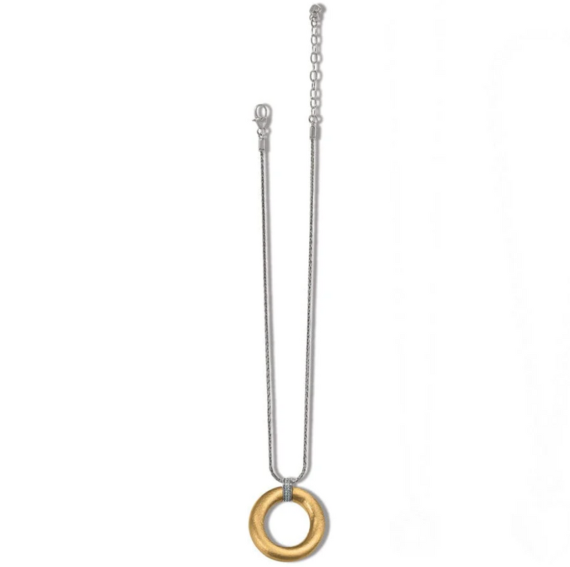 Flat lay of two-tone pendant necklace