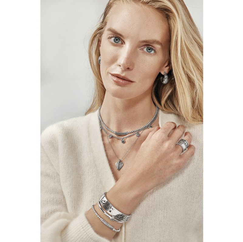 Necklace styled with a v-neck blouse