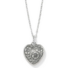 Close-up of silver heart pendant with sparkling sapphire crystals