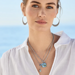 Model wearing Brighton Sydney Daisy Necklace, highlighting floral elegance