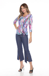 Carine Carlie V-neck top with three-quarter sleeves, scrunched drawstring detail on the left hip, and lightweight crinkle fabric with laser burnout, perfect for travel. In the pattern Aurora Flame.