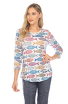 Round-neck top with 3/4 sleeves, contrast stitching, and a curved hem for a flattering fit. Made from lightweight burnout crinkle fabric, perfect for travel. In Pattern Fish.