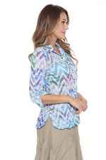 Sabrina Shirt with snap-button front, faux sleeve ties, and curved hem—lightweight and versatile travel top for women. Chevron Haze.