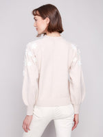 Back view of 23" length soft knit crew sweater