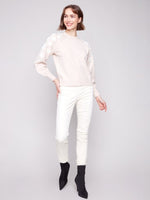 Cozy crew neck sweater styled with jeans for fall