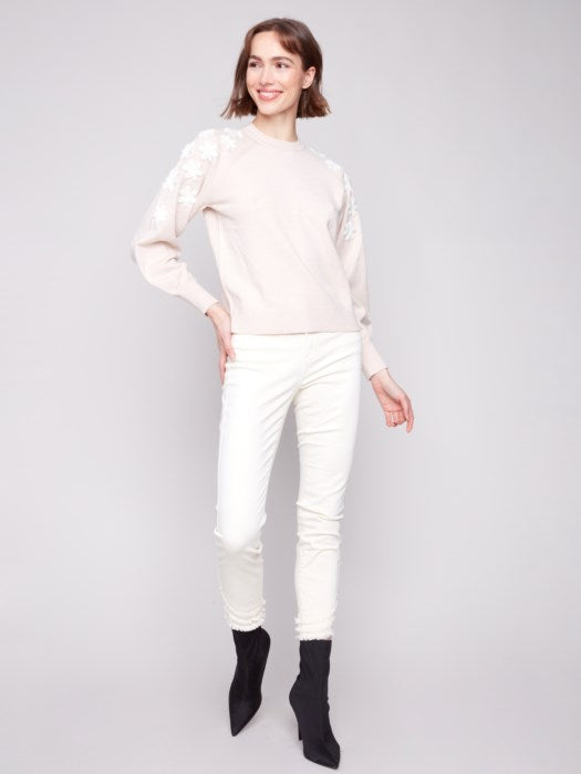 Cozy crew neck sweater styled with jeans for fall