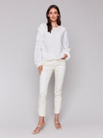 Front view of relaxed fit cotton blouse with embroidered eyelet details in white
