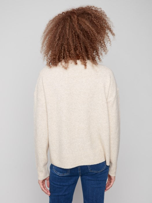 Cozy crew neck sweater with large floral design