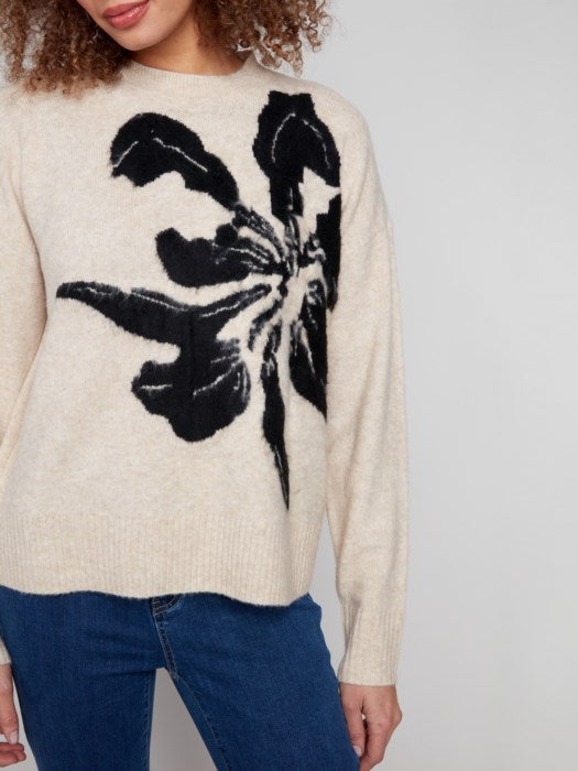 Detail of bold flower knit pattern on Charlie B sweater