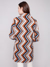 Women’s mid-thigh crochet coat layered for fall fashion at The Lazy Daisy