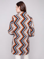 Women’s mid-thigh crochet coat layered for fall fashion at The Lazy Daisy