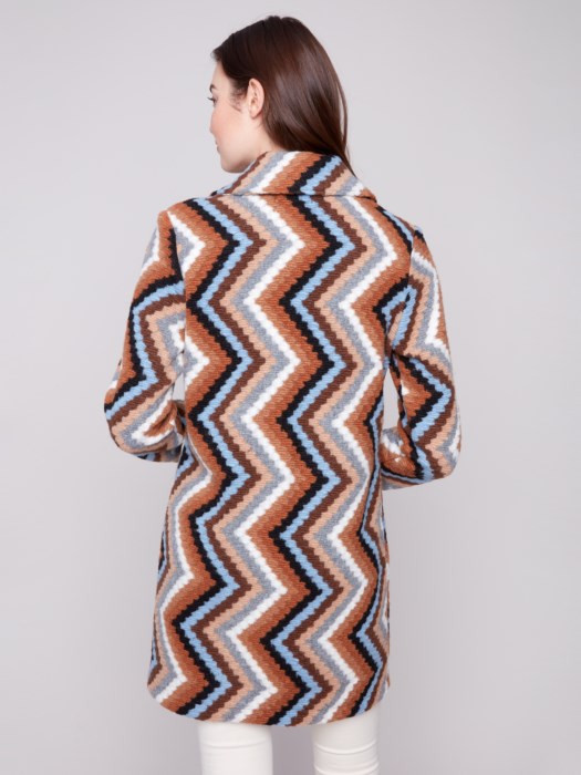 Women’s mid-thigh crochet coat layered for fall fashion at The Lazy Daisy