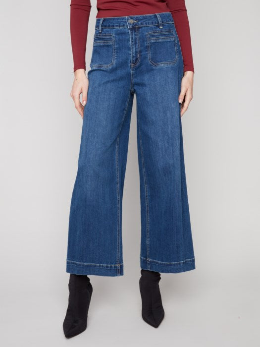 Front view of mid-rise flare denim with patch pockets