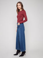 Side view of Charlie B cropped flare stretch denim