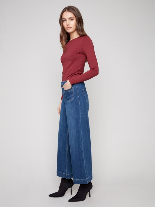 Side view of Charlie B cropped flare stretch denim