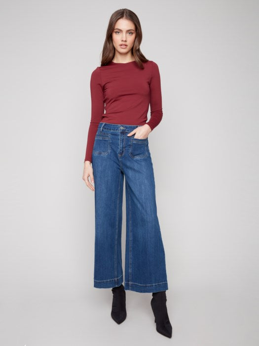 Fall outfit with cropped patch pocket flare jeans and boots