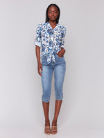 Lightweight button-down blouse with embroidered eyelet pattern