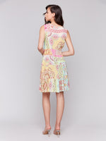 Charlie B printed tiered dress with flattering V-neck, ideal for warm weather