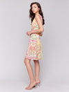 Full view of Charlie B printed sleeveless V-neck dress worn as casual outfit