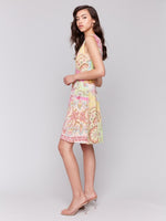 Full view of Charlie B printed sleeveless V-neck dress worn as casual outfit