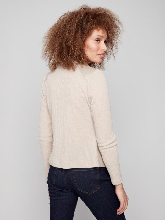 Back view showing rib knit panel on jacket