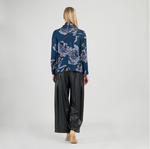 Model wearing soft turtleneck sweater with floral sketch print
