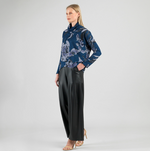 Side view of relaxed fit turtleneck sweater
