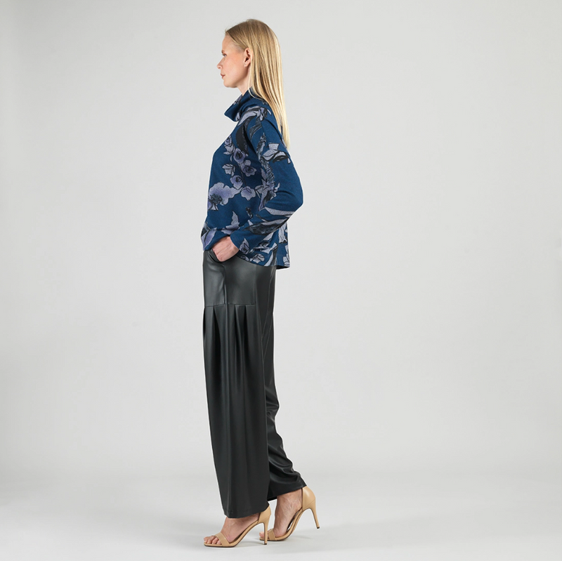 Side view of relaxed fit turtleneck sweater
