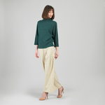 Cozy funnel neck sweater styled with casual pants for fall
