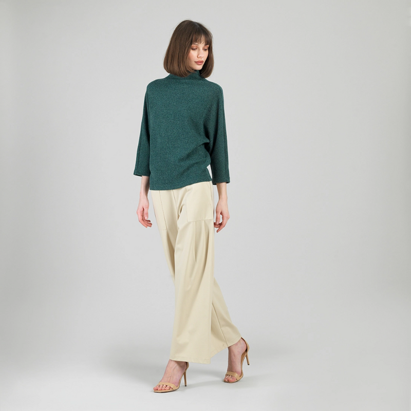 Cozy funnel neck sweater styled with casual pants for fall