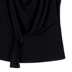 Close-up of draped loop-front design and asymmetrical silhouette