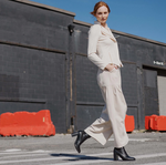 Model wearing classic lightweight leather-look jacket in ivory