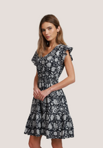 Side view of tiered A-line cotton dress with flutter sleeves