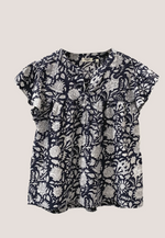 Close-up of shirring detail and floral pattern on Dylan Magnolia Top