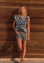Front view of relaxed cotton popover blouse with open neckline