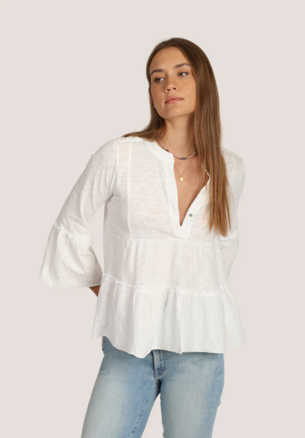 Front view of Wren Top with v-neckline and ¾ bell sleeves in the color white