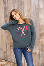 Boxy fit holiday crewneck sweater with candy cane design from Wooden Ships