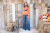Festive striped Halloween sweater with ribbed hem and cuffs
