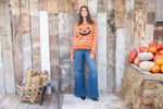 Festive striped Halloween sweater with ribbed hem and cuffs