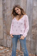 Cozy v-neck sweater with playful mini martini design and ribbed details