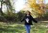 Close-up of chunky knit ghost design on boxy crewneck sweater