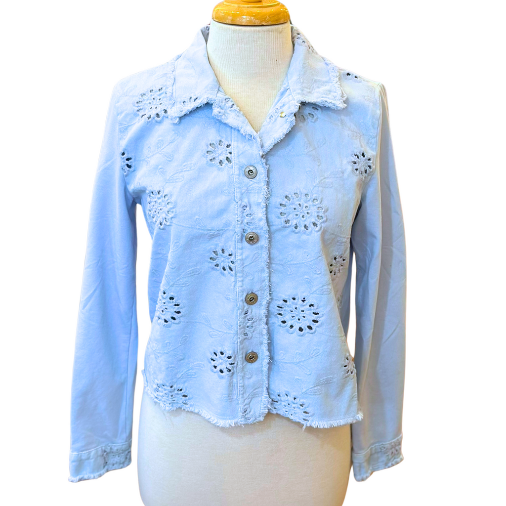 Femme Fatale Embroidered Eyelet Jacket – Women's cropped spring jacket with button front, eyelet embroidery, frayed edges, and soft stretch jersey sleeves and back. Stylish and versatile layering piece. In the color Ice.