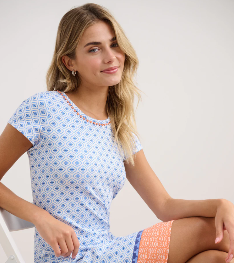 The Cici Dress with painted petals design, perfect for warm weather events