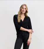 Soft knit twisted front sweater in neutral black color